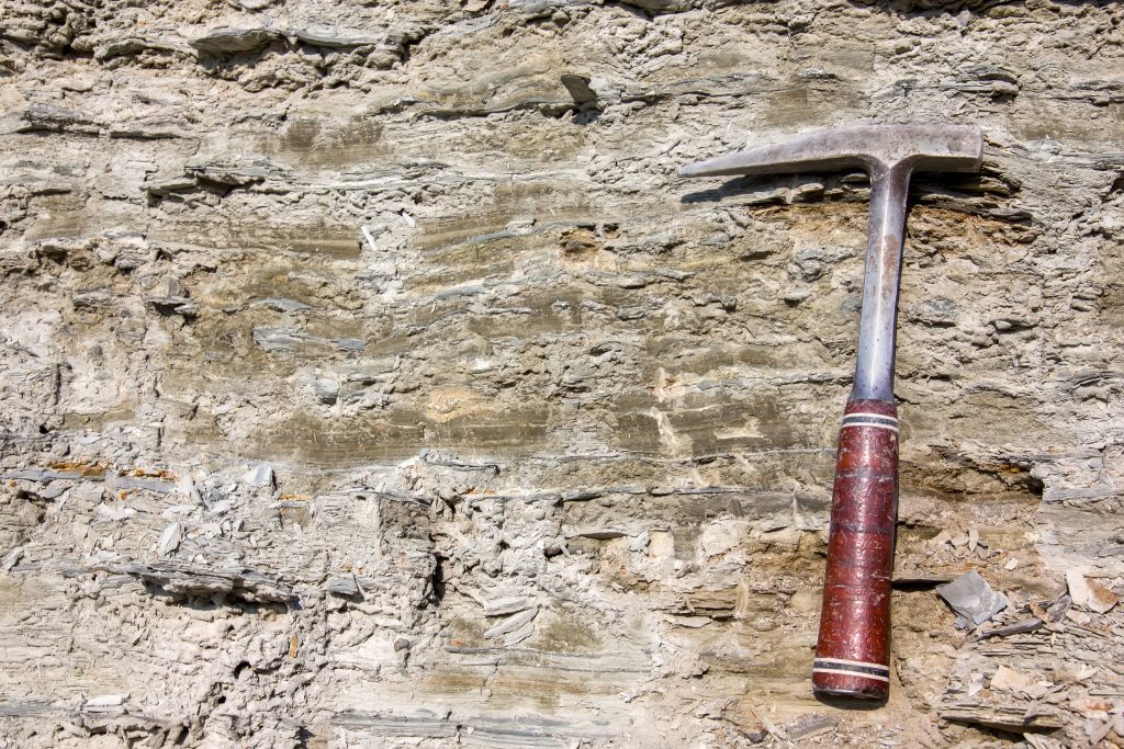 Geological hammer on the rocks
